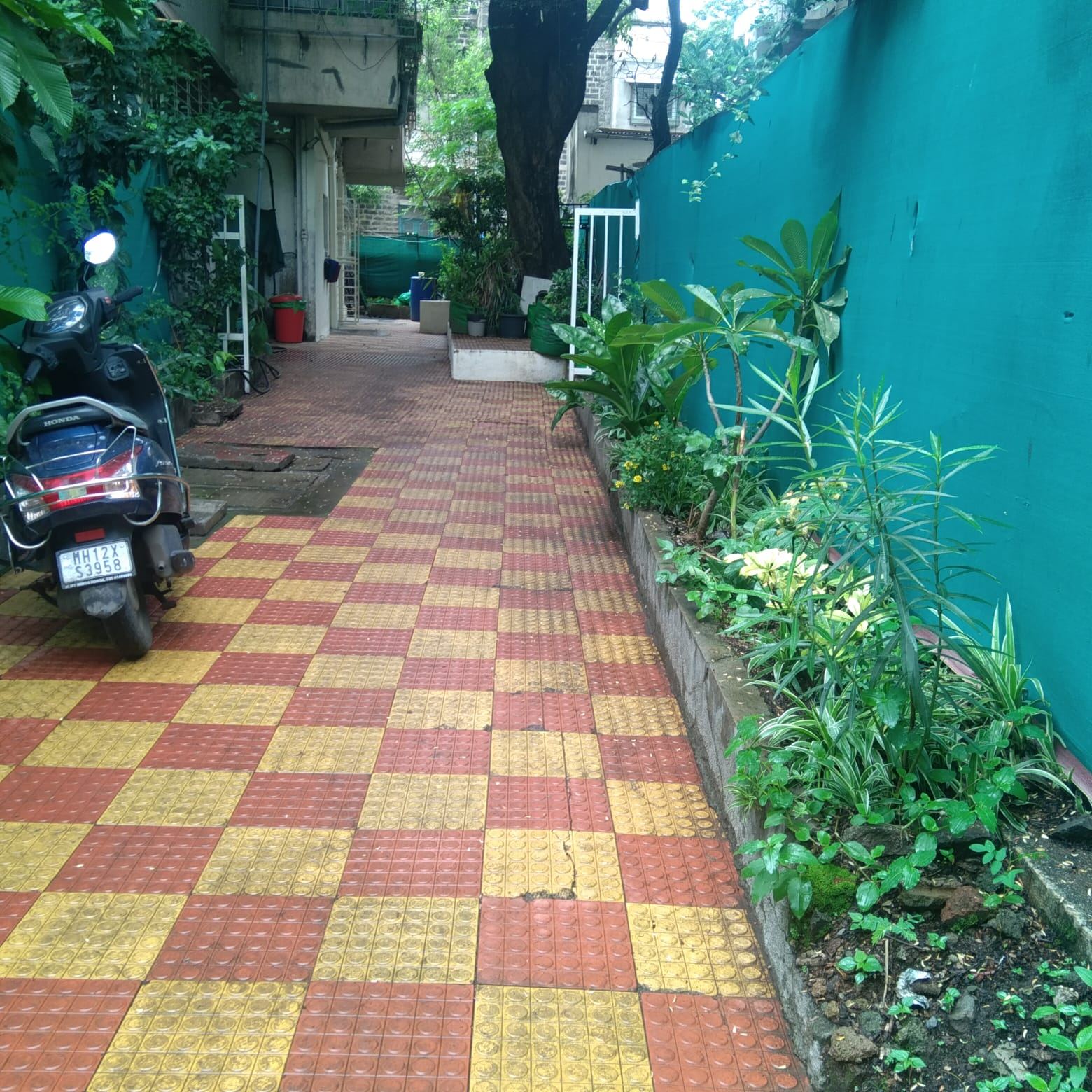 Courtyard walkway and parking at Vidya Girls PG